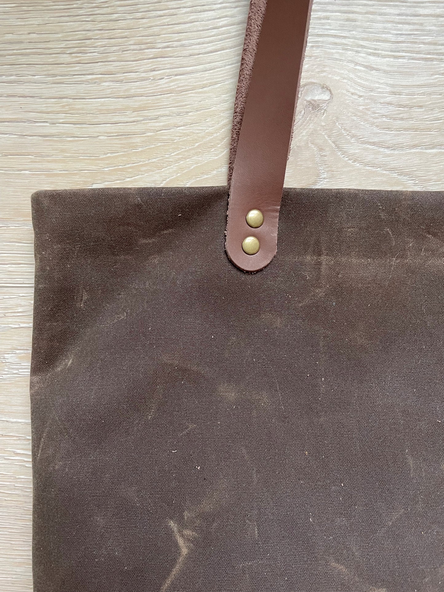 Brown waxed canvas tote bag
